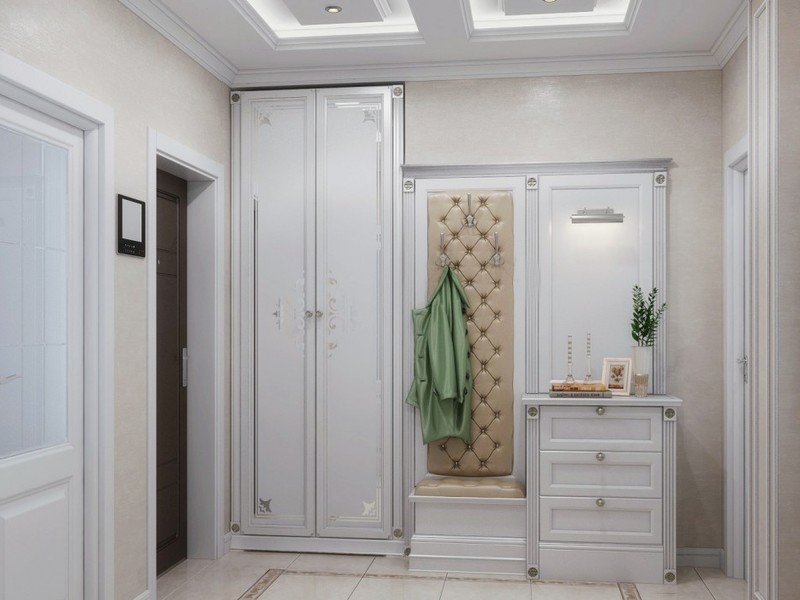 Petit hall d'entrée avec une armoire blanche