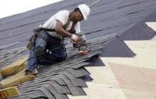 Man repairs a soft roof